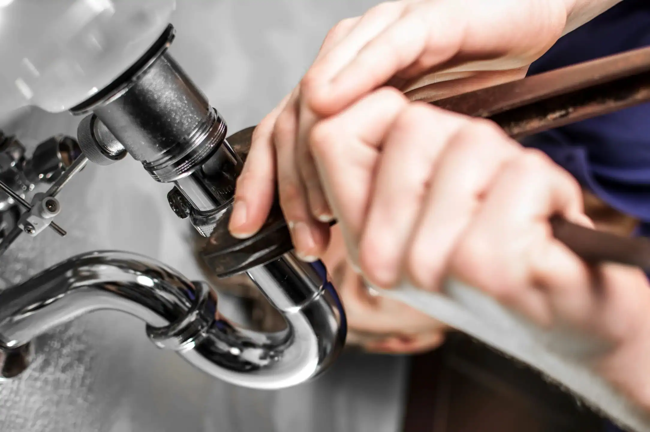 Plumber-Installing-Sink-P-Trap-Drain-Assembly